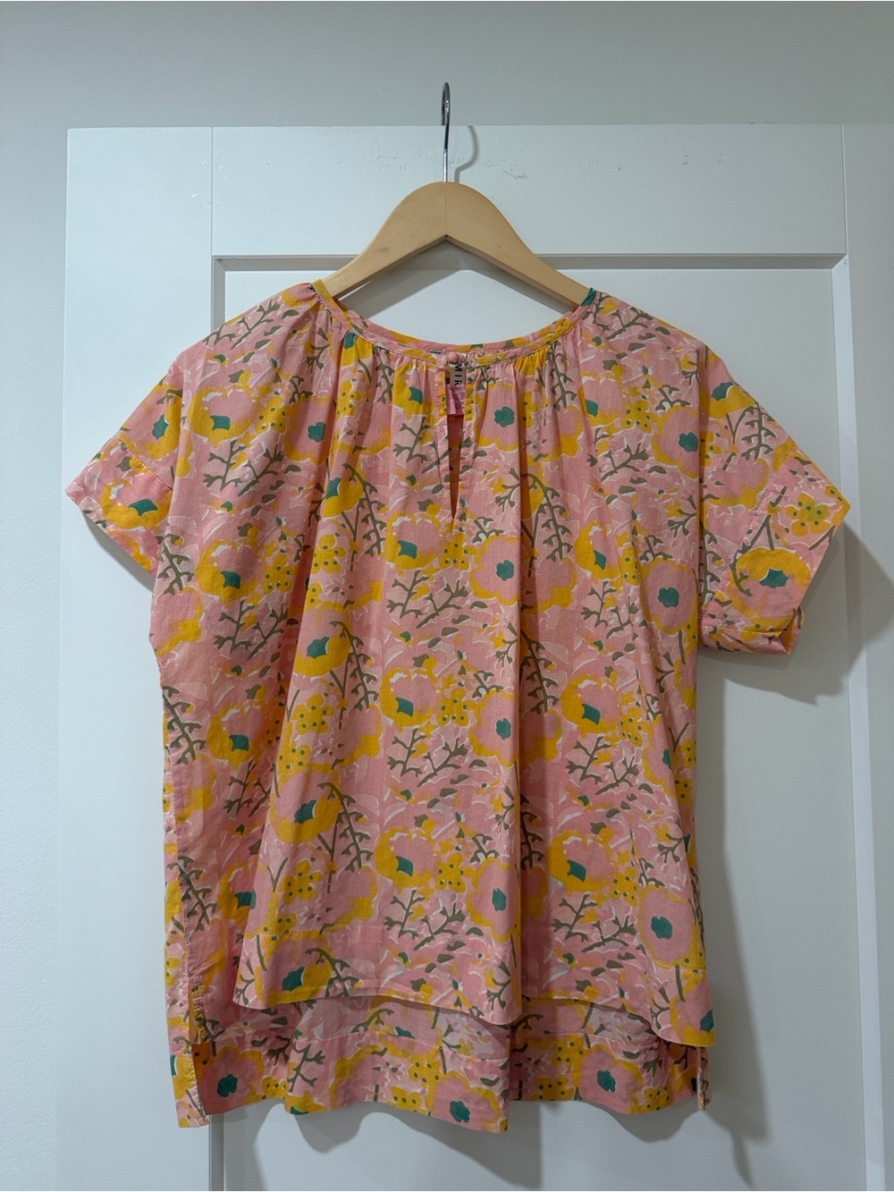 MIRTH short-sleeve split-neck blouse featuring their signature handmade "P